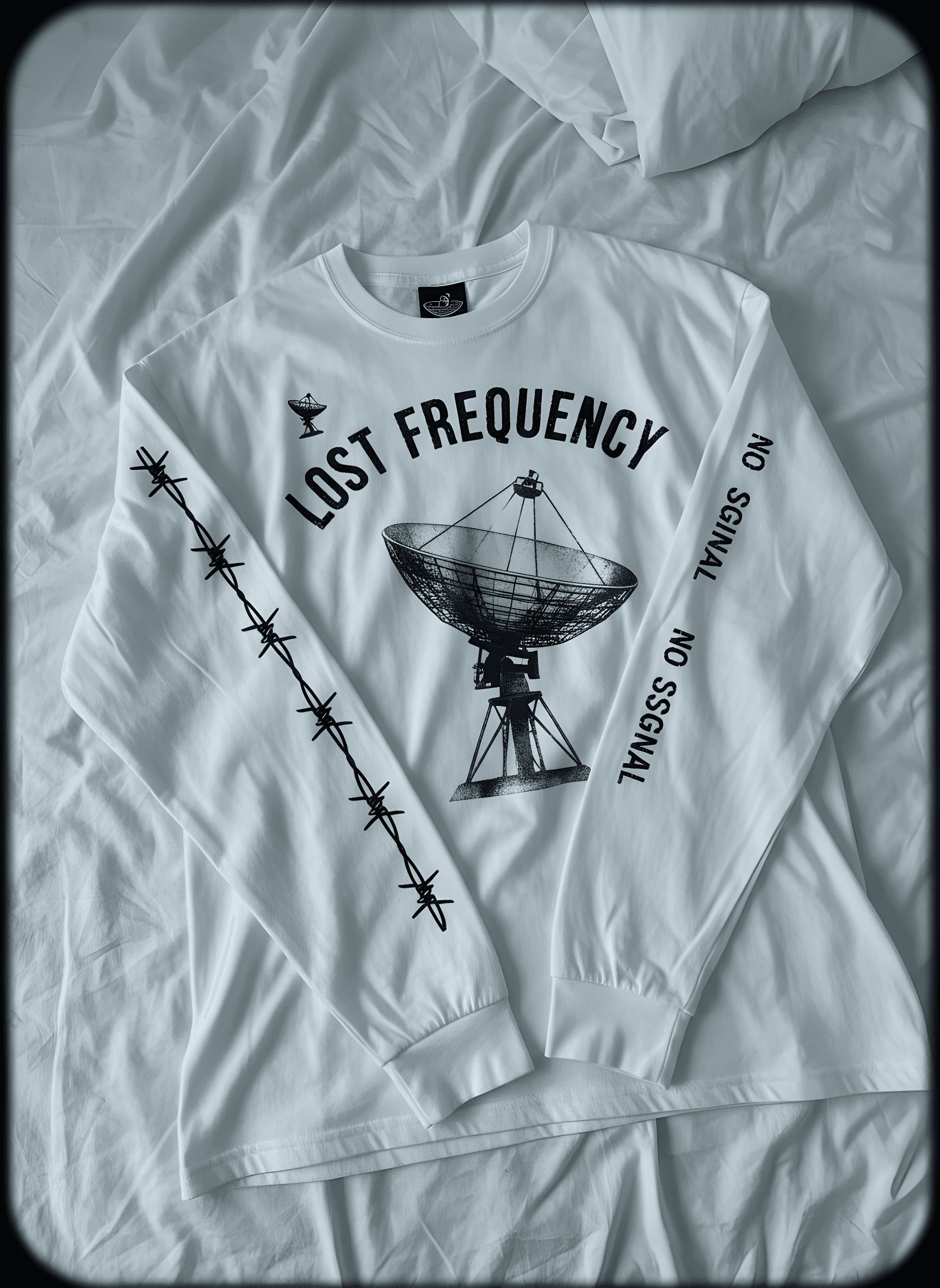 amateur phone photo of the lost frequency long-sleeve laid on the floor — the input
